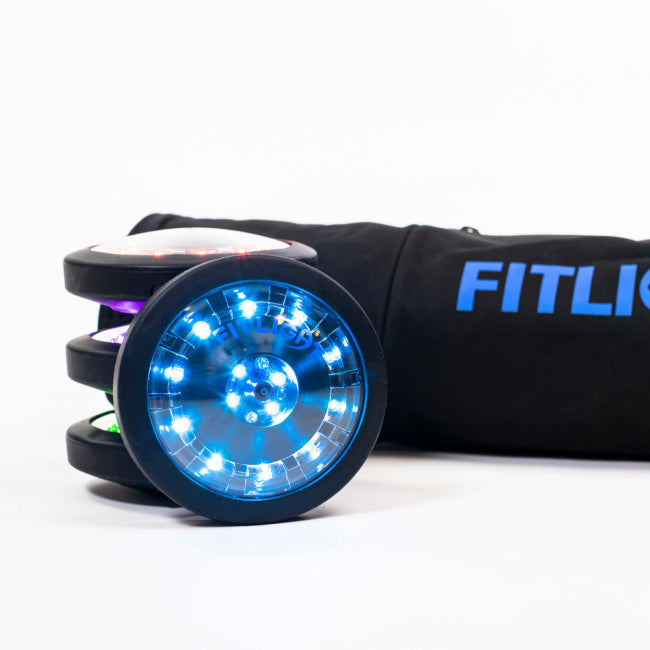 The FITLIGHT® system is a wireless LED lights system designed for elite reaction and cognitive training. Patented sensors register both impact (touch) and motion. Lights are incredibly durable and flexible, and the system can be used indoors or outdoors up to 50M-75M away from the device. Accessories include velcro attachments, charging cables, and a carrying bag for portability. Operated with a subscription-free App, users can customize and choose from over 30 preprogrammed drills in 8 categories