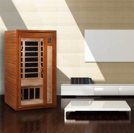 Dynamic Barcelona 1-2-person Low EMF (Under 8MG) FAR Infrared Sauna (Canadian Hemlock) DYN-6106-01 by Golden Designs Crafted from natural hemlock wood, this sauna features 6 carbon heating elements for even heat distribution. Enjoy user-friendly controls, chromotherapy lighting, music system, and privacy with the tempered glass door. Easy assembly and durable construction ensure a hassle-free experience. 