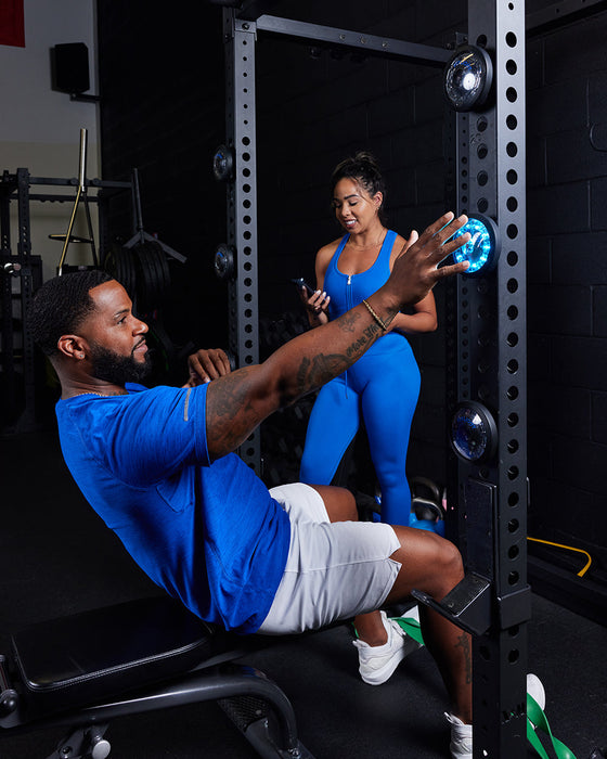 The FITLIGHT® system is a wireless LED lights system designed for elite reaction and cognitive training. Patented sensors register both impact (touch) and motion. Lights are incredibly durable and flexible, and the system can be used indoors or outdoors up to 50M-75M away from the device. Accessories include velcro attachments, charging cables, and a carrying bag for portability. Operated with a subscription-free App, users can customize and choose from over 30 preprogrammed drills in 8 categories