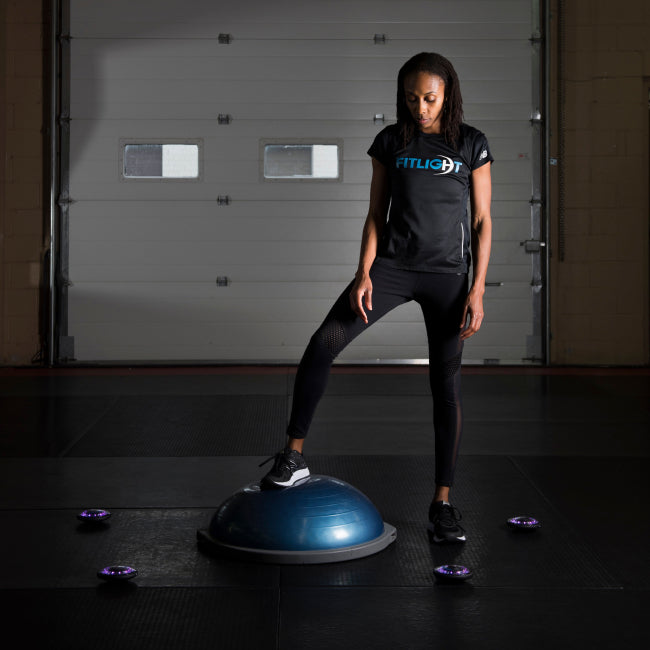 The FITLIGHT® system is a wireless LED lights system designed for elite reaction and cognitive training. Patented sensors register both impact (touch) and motion. Lights are incredibly durable and flexible, and the system can be used indoors or outdoors up to 50M-75M away from the device. Accessories include velcro attachments, charging cables, and a carrying bag for portability. Operated with a subscription-free App, users can customize and choose from over 30 preprogrammed drills in 8 categories